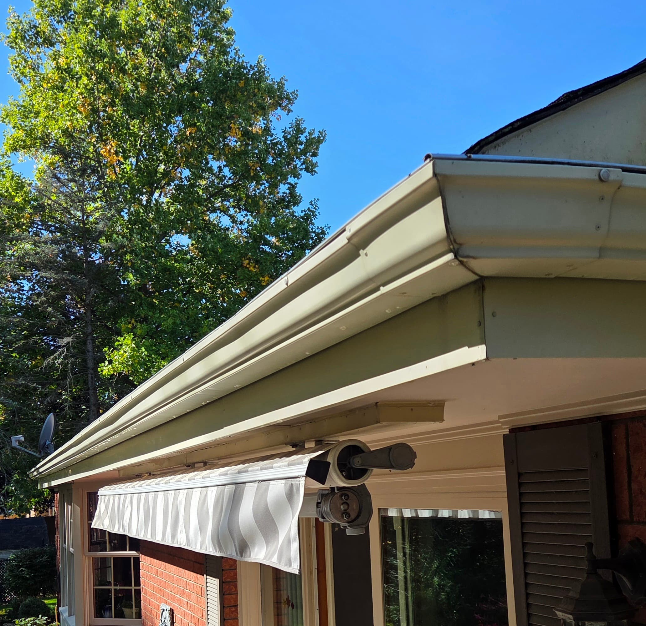 After professional eavestrough cleaning — clean, bright gutters